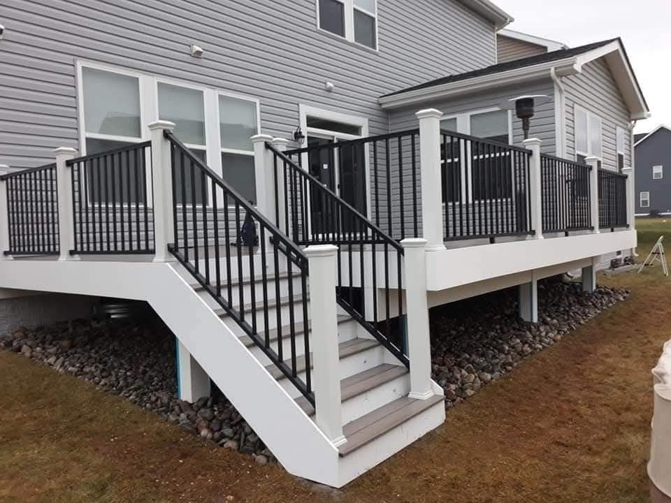 Modern white composite deck with black metal railings after resurfacing in Leesburg VA