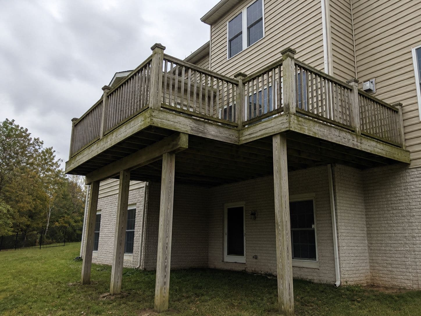 High-elevation wood deck with moss and algae growth before replacement in Ashburn VA
