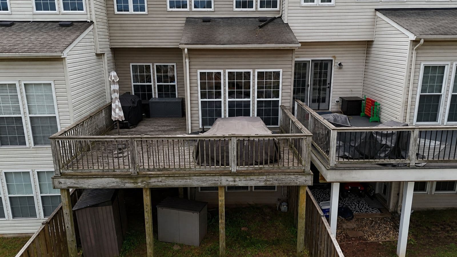Worn townhome wood deck before full renovation in Sterling VA