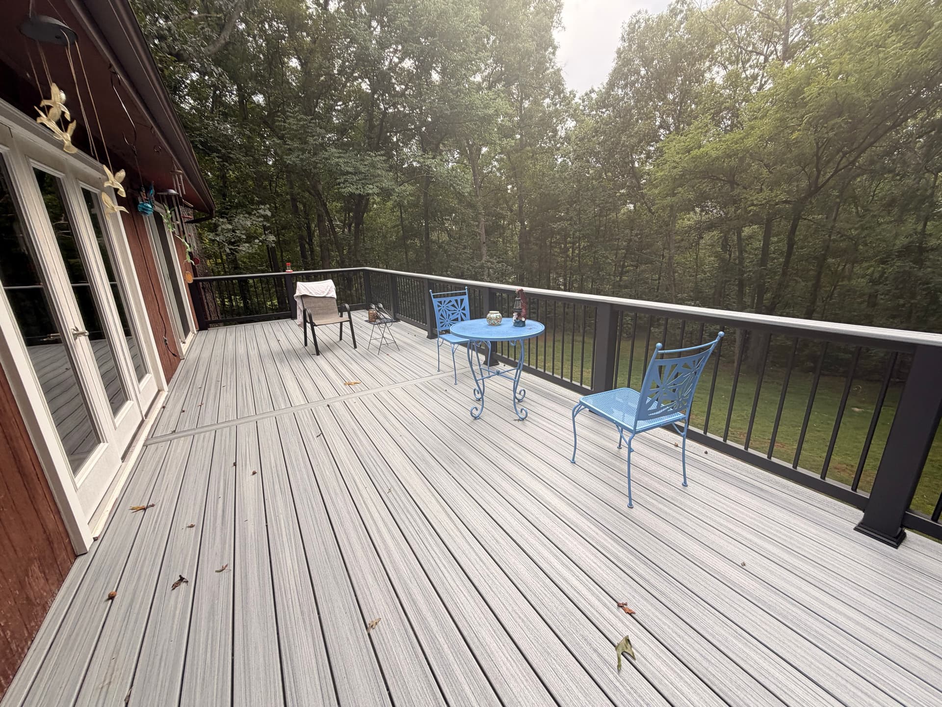 Trex Enhance Foggy Wharf decking with black railings at this Loudoun Decks project in Gainesville, Virginia.